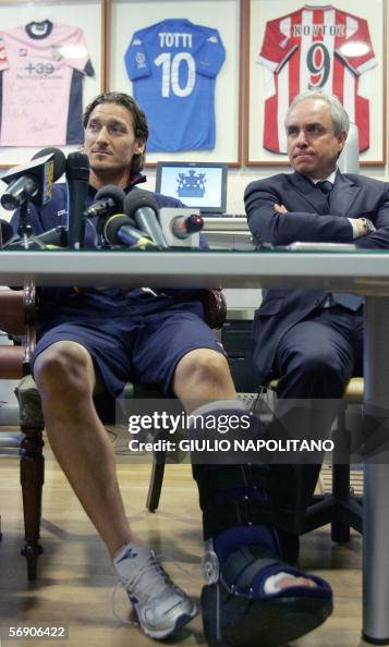 AS Roma captain Francesco Totti (L) give AS Roma captain Francesco Totti (L) give