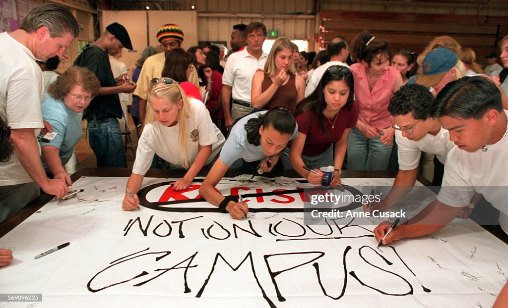 Student at Cal Lutheran University sign a poster against Racism on Campus after hearing Joe Hicks sp