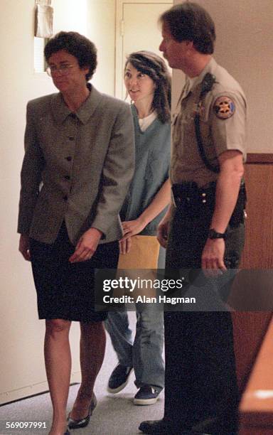 Diana Haun, center enters courtroom Wednesday, with attorney Susan Olson for arraignment on charges she murdered Sherri Dally. Haun and Michael...