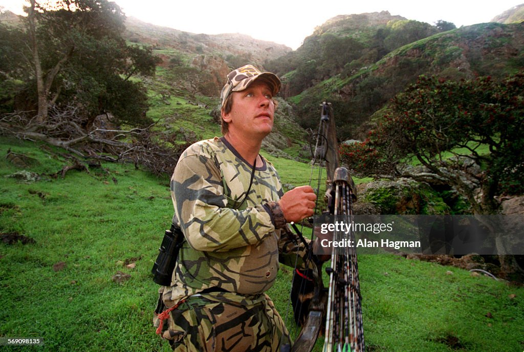 Rick Berg, a caretaker on Santa Cruz Island, scans the rocky walls surrounding one of his favorite c