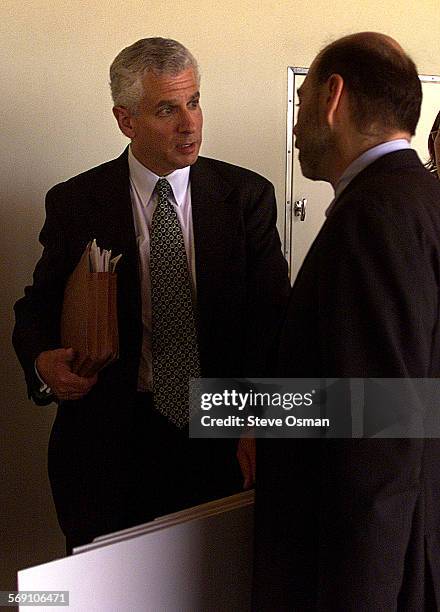 John Reiner, left, talks with his lawyer, William Genego, after verdict. Century City attorney John Reiner, left, listens as his attorney, William...