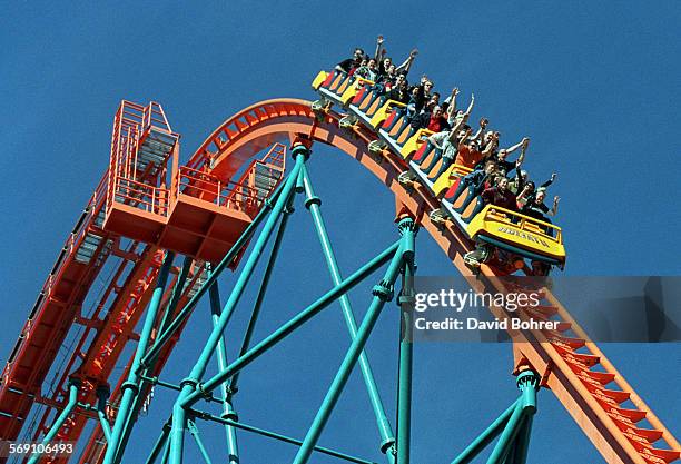 Roller coaster riders throw their hands in the air as they ride "Goliath," the newest roller coaster at Six Flags Magic Mountain.