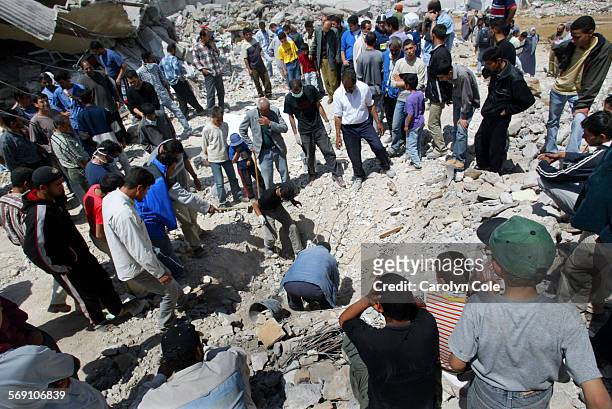 Rubble4.cc; In Jenin refugee camp, residents gather to dig for their dead family members. One man, Mohammed Masoud Abu Siba, died days after being...