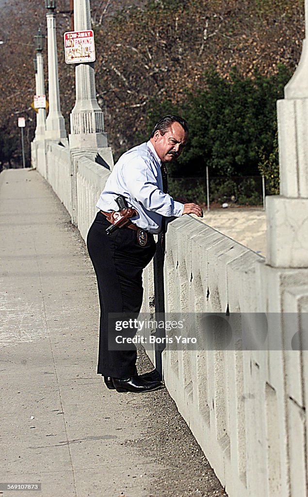 LAPD Northeast Division homicide detective John Berdin (cq) looks down at LA River from the Riversid