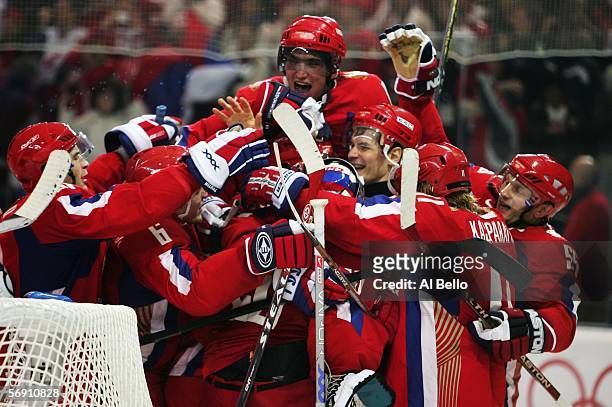 Team Russia celebrates defeating Canada 2-0 in their quarter final of the men's ice hockey match during Day 12 of the Turin 2006 Winter Olympic Games...