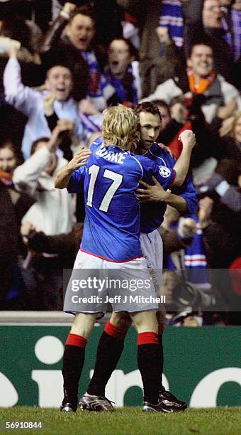 Chris Burke Thomas Buffel of Rangers celebrate the second goal during the UEFA Champions League match between Rangers and Villarreal at Ibrox Stadium...