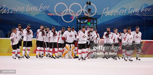 Team Canada stands on the ice after falling to Russia 2-0 in their quarter final of the men's ice hockey match during Day 12 of the Turin 2006 Winter...