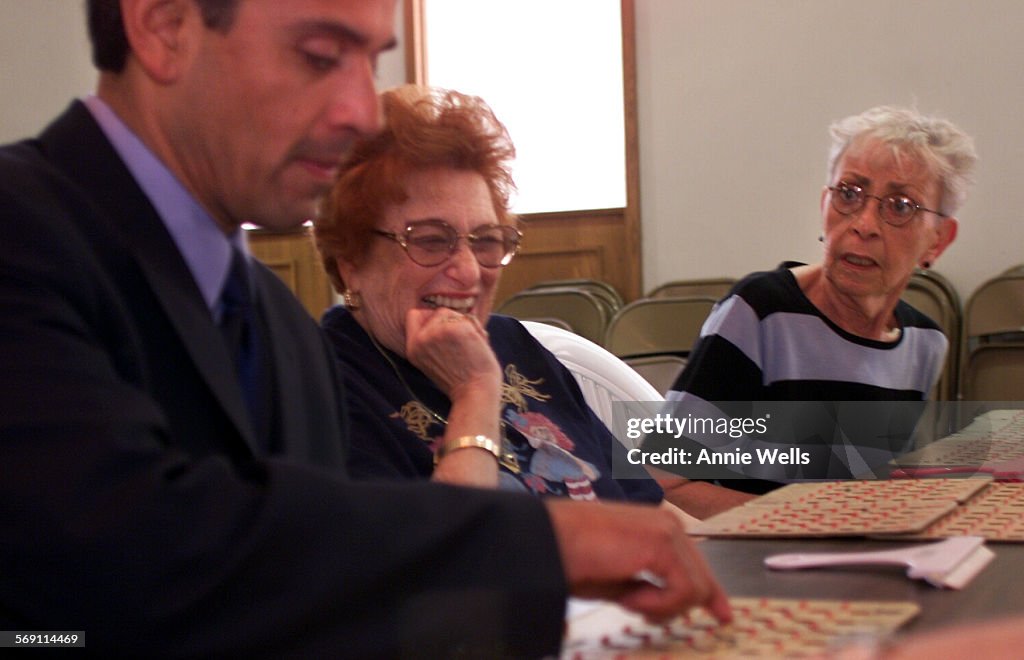 029370.ME.0504.antonio.3 Antonio Villaraigosa receives a some Bingo tips from Dona Diamond (cq) and 