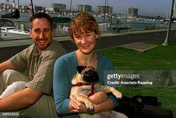 Make2.AR Kirstin Pesola and her husband Brendan McEachern walk in Marina del Rey with their dog "Fenway" on 3/17/01. Pesola and McEachern are the...