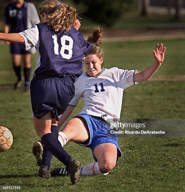 Katie McCurdy, No. 11, of Westlake High School fighting for ball with Brittany Del Soldato, No. 18, of Crescenta Valley, during a soccer playoff game...
