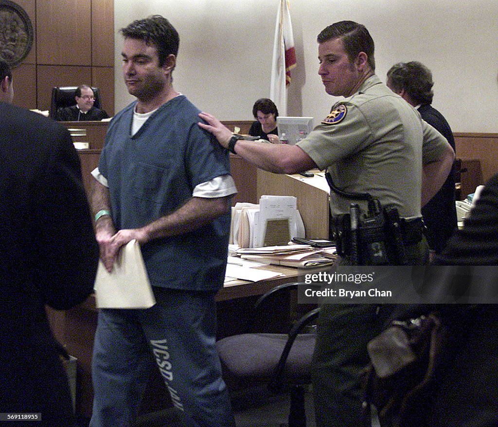 Andrew Luster, left, is led away after his bail hearing in Ventura County Superior Court Wednesday.