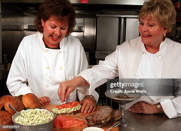 Sandtwo.3 Sue Campoy, right, owner of Julienne, puts the final sprinkles of cracked pepper on a Smoked Salmon and Egg Salad Sandwich that Ctering...