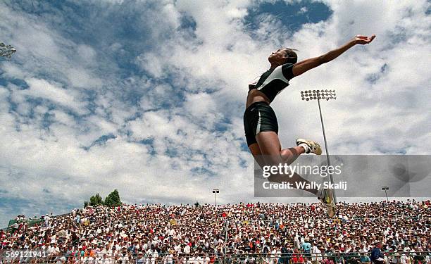 Trials1.WS Marion Jones leaps her way to winning the women's long jump during the U.S. Olympic Track and Field Team Trials in Sacramento Sunday.