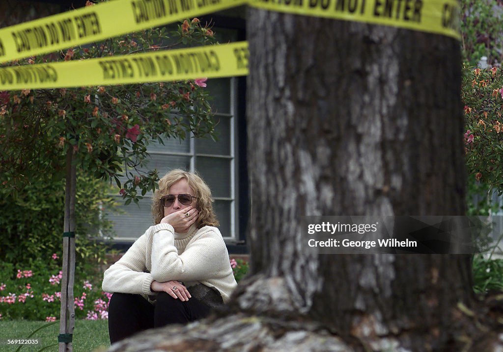 Homeowner Holly Ziman sits in her front yard in Northridge and waits for the crew from the county Ve