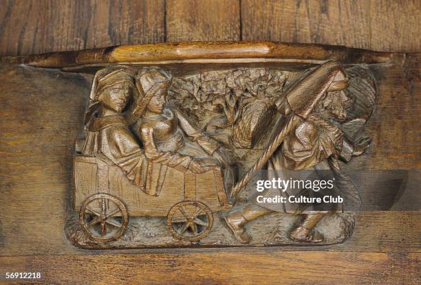 Carving depicting a couple in a cart pulled by a man, from a choir stall