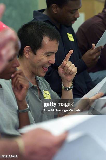 James Sie, center, and a group of professional actors perform the play writen by Canoga Park High School student Josh Conoway as part of a...