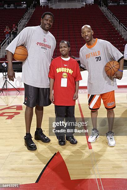 Make a Wish recipient, Tom Vaworsky , poses with Houston Rockets assistant coach Patrick Ewing and Sam Cassell of the Los Angeles Clippers on...