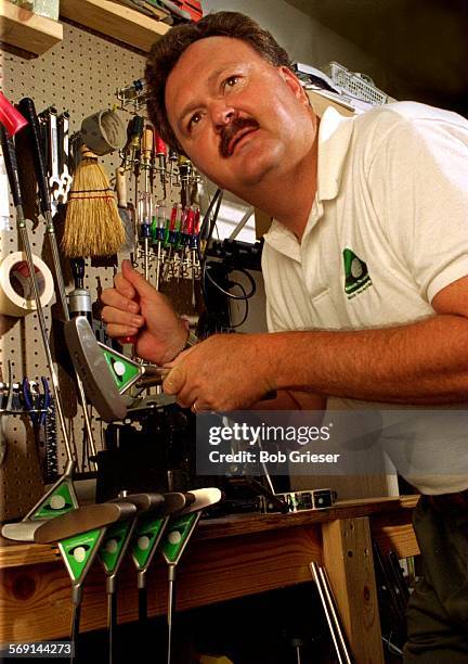 Putter/Pritchett.1/4.BG.3Jul96--Ronnie S. Pritchett in his garage work shop putting the heads of his Bermuda Triangle Putter onto shafts. This is his...