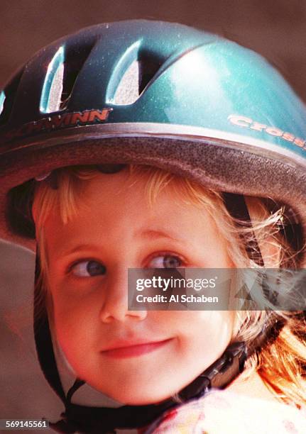 Helmet.0601.ASAshley Brookman of Anaheim, sports a Schwinn helmet at the Garden Grove Police Department Wednesday for a campaign by Schwinn and the...