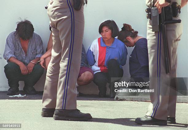 Smuggler.Detain.DB.5/29/97.FountainValley. Near the Euclid Ave exit from N. 405, CHP officers detain 4 undocumented immigrants. The Mexican nationals...