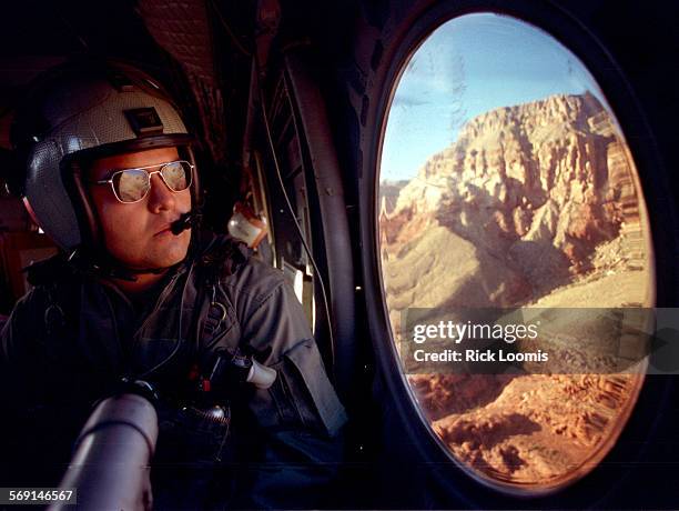 Toysfortots#5.1220.RLSupai,Az.Lance Cpl. Aaron Acosta, of the El Toro based HMM764 Marines looks out over the Grand Canyon area during a Toys for...