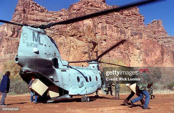 Toysfortots#1.1220.RLSupai, Az. Members of the Flagstaff Marine Corps League, San Francisco Peaks Detachment, unload toys from a CH46 Marines...