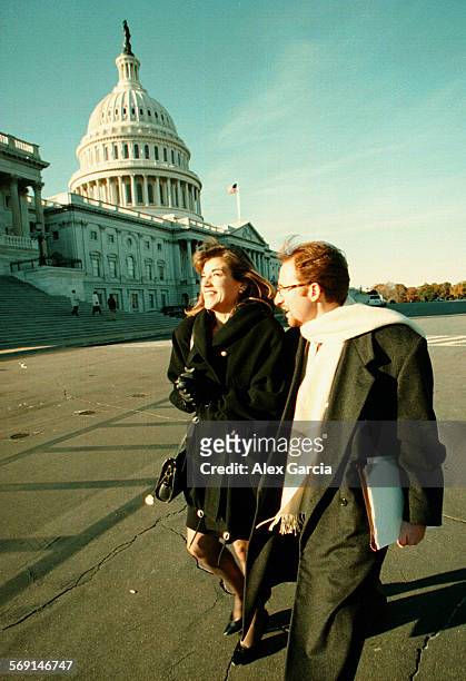 Sanchez.walking.0102.AAGU.S. Congresswoman Loretta Sanchez has a smile on her face as she walks with campaign manager John Shallman towards her...