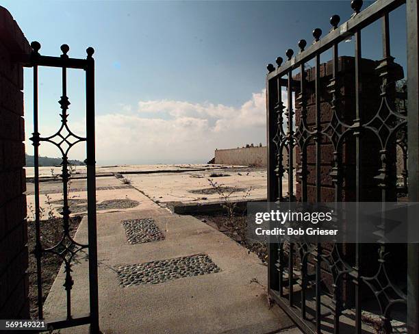 Anniversary.gate.2.BG.23oct97Symbolic, the front yard gate to a home atop Skyline Drive in Laguna Beach where fire swept away the home and all the...