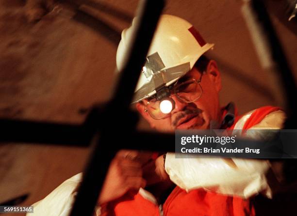 Tunnel.4.bv.122/NEWHALL PASS  Metropolitan Water District Lake Matthews Construction Services worker Allan Schlobohm toils by headlight inside the...