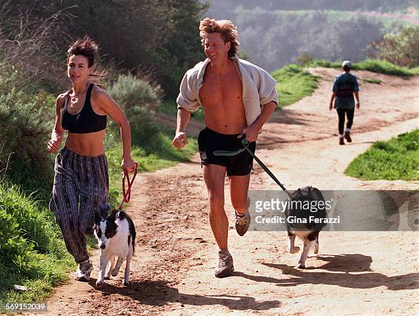 Fernandez2.0202.GF.8Giselle Fernandez, host of NBC's "Access Hollywood," jogs with her friend, Don Dahler, and two dogs, Skye and Nellie Bly, along...