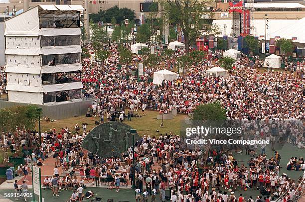 In contrast to the past three days when Centennial Olympic Park was closed due to the bombing, crowds jam the area around the tower where the...