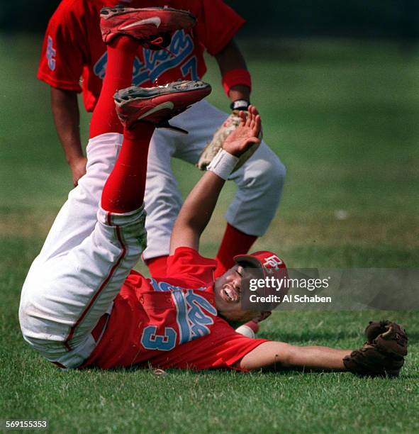 Baseball.dropball.0418.ASGARDEN GROVEBolsa Grande's Isaac Gonzalez tumbles upside down in a failed attempt to make a catch against Pacifica...