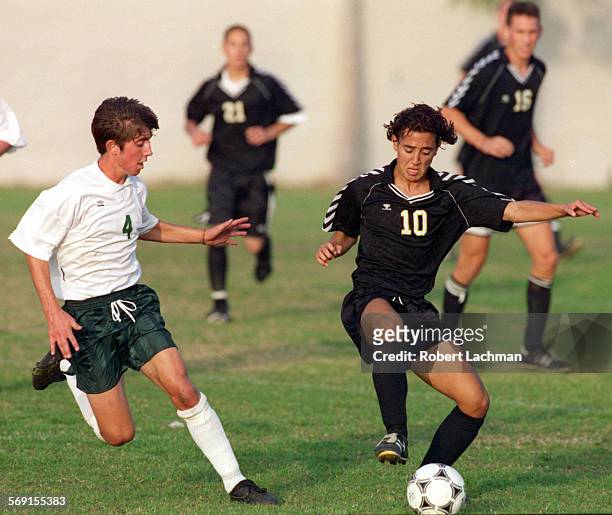 Soccer/Edison.RDL Jake Roquemore of Edison and Ernesto Fonseca of El Dorado battle for the ball in their soccer game at Edison High School in...