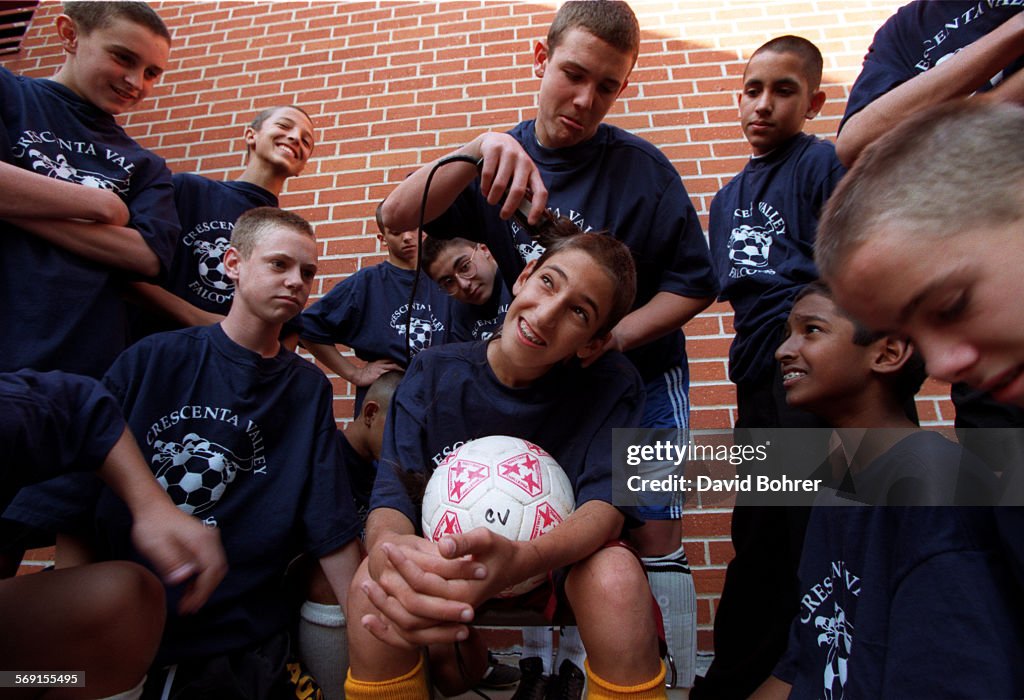 SF.Shaved.#2.db.1119; Bornah Moghbel (cq,sitting), 14, a freshman member of the Crescenta Valley bo