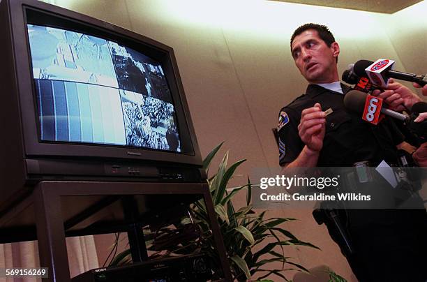 Sgt Rick Martinez, of the Anaheim Police Department reviews surveillance video taped when Haeng Shin Kim was killed in his Lucky 7 market last...