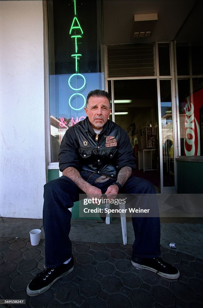 George Christie, President of the Ventura Chapter Hells Angels, in front of his tattoo parlor Wednes