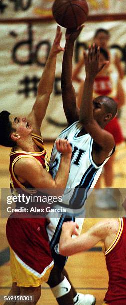 Hoops.0129.AAGEstancia's Ryan Simpson goes up on defense against University High School's Justin Hunt during their game at Irvine.