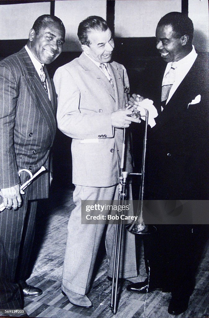 20010520 (LA)  Ory, center, jokes with Andrew Blakeney, left, and Louis Armstrong in a 1948 photo.