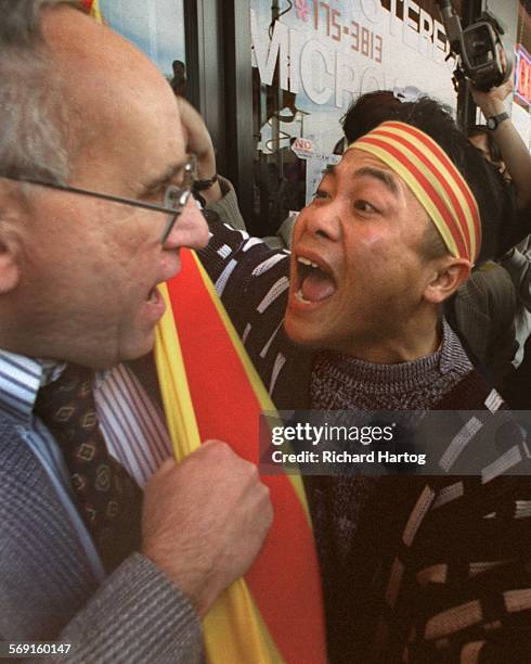 Protest.Confrontation.RH0211998Separated by only a South Vietnamese flag, protester Giang Ho , right, has fighting words for David J. Brown in...