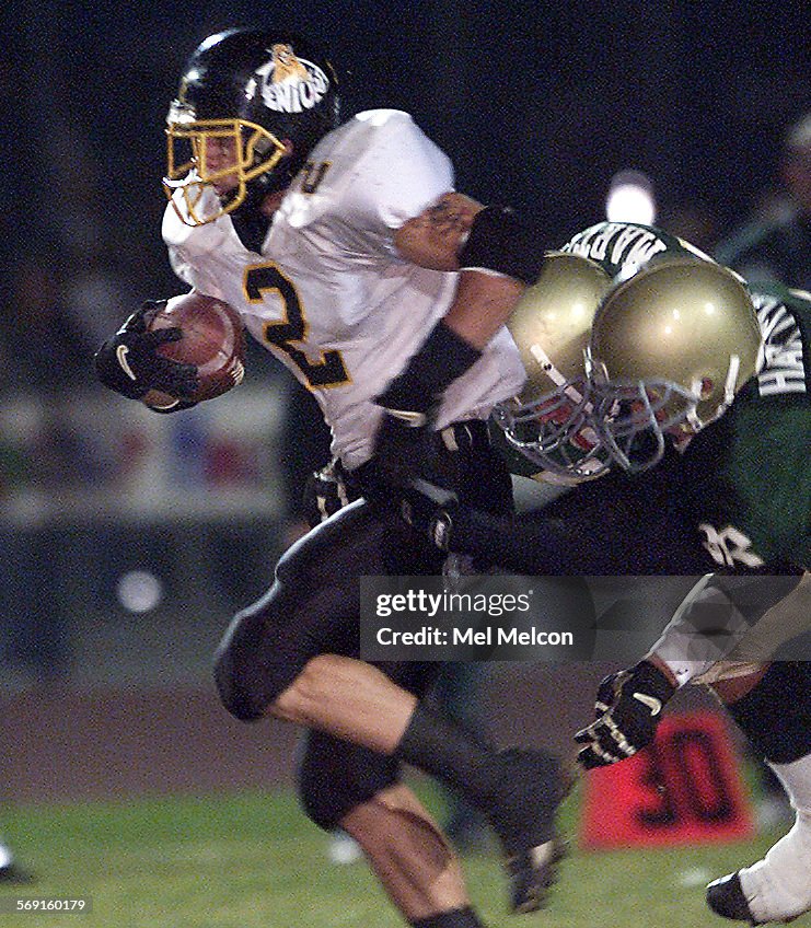 DIGITAL IMAGE SHOT ON 11/24 /2000Tyler Ebell of Ventura H.S. carries the ball for a first down duri