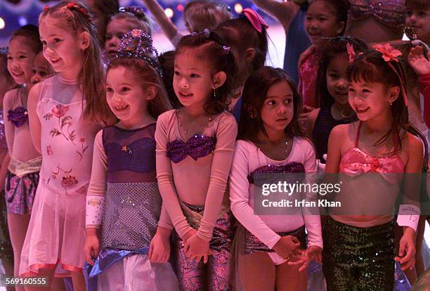 Mermaid.3.1229.D.IK ; Anaheim, December 29Little girls dressed in Little Mermaid costume wait for the results of "Ariel Sing & Skate" competition...