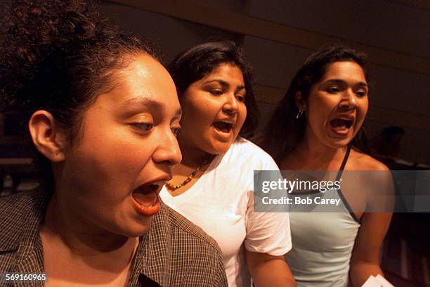 Estrella Esparza, left, katrina Valdez, and Primavera Valdez rehearse Luis Valdez's groundbreaking play, "Zoot Suit," in a LA Theatre Works radio...