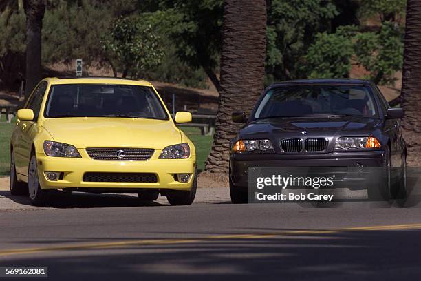 The Lexus IS300, left, and the BMW330, right, in Elysian Park.