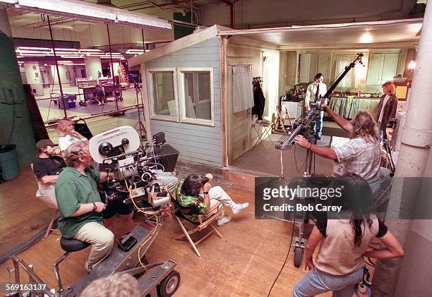 Annex. 1.1002.BC/gA movie crew for upcomming CBS program "EZ Streets" shoots a scene with actors Jason Gedrick and Sarah Trigger, upper right, in...