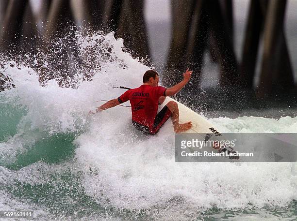 Surf.Malloy.RDL Keith Malloy rides a wave during his heat at the GShock US Open next to the Huntington Beach Pier in Huntington Beach. TIMES