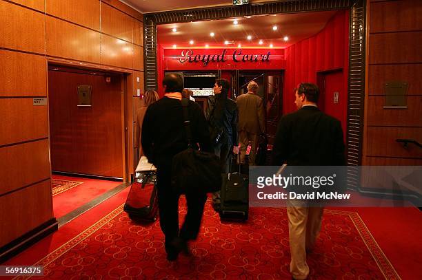 Visitors walk toward the entrance of the Royal Court Theatre aboard the Queen Mary 2 Commodore Warwick cruise ship on its maiden call to the Port of...