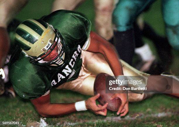 Football.Rancho.DB.11/21/97.GardenGrove. Rancho AlamitosÕ, Shawn Young recovers a fumble in first quarter action against Aliso Niguel. Playoff game...