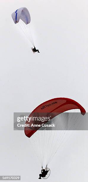 One of the three members of the Paraglide America Team begins his journey across the United States from Ventura Harbor. Flying below is Mike...