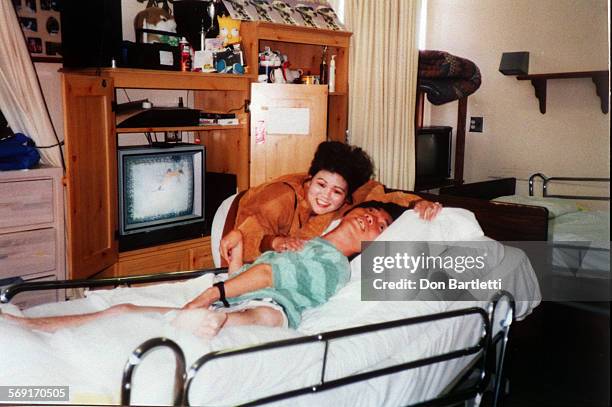 Parents.Kawaguchi.8/28/97. In this copy of a 1995 snapshot, Raymond Kawaguchi is visited by his sister Teresa Kawaguchi Anamunthodo at the Fairview...