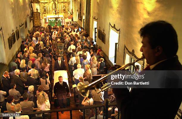 After the Requiem mass, the body of Salvador Chava Uribe is moved from the Serra Chapel at Mission San Juan Capistrano. Marin Lara plays with a...